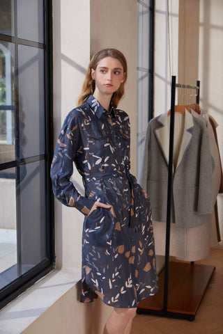 Navy printed long-sleeve button-front dress with turn-down collar, side view.