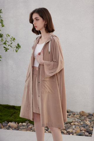 Brown hooded longline jacket with flap pockets, front buttons, and drawstring cords
