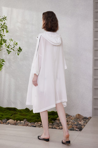 White longline hooded jacket shown from back with buttons and beaded shoulders
