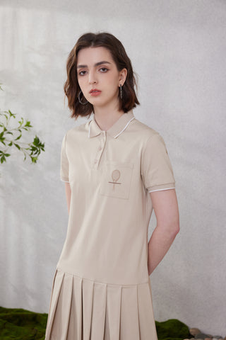 Camel cotton polo dress with embroidered racket on chest and front button placket.