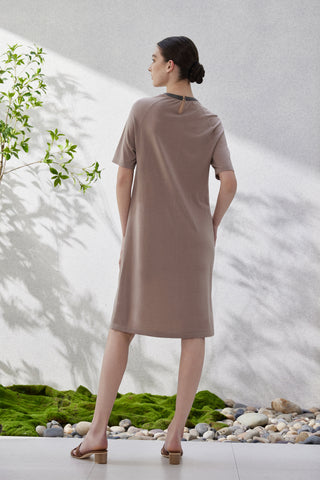 Back view of taupe short-sleeve knit dress with dark collar trim
