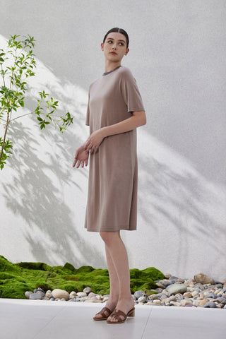 Taupe knit short-sleeve midi dress with dark beaded neckline trim, side profile