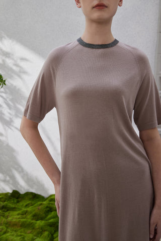 Close-up: taupe knit dress bodice with dark beaded round neckline trim