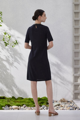 Black knit dress back view with keyhole opening at upper back