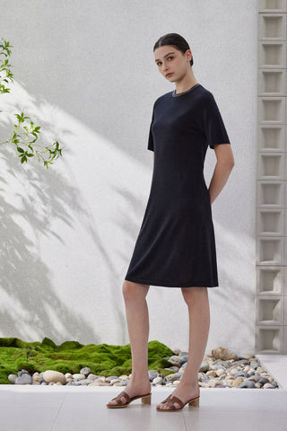 Black short-sleeve knit dress, simple straight silhouette with dark neckline trim