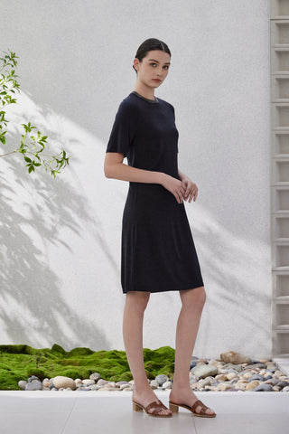 Black short-sleeve knit dress front view with dark neckline trim