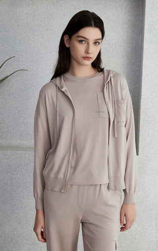 Light gray hooded zip knit cardigan front view with chest pocket, drawstring hood, zip.