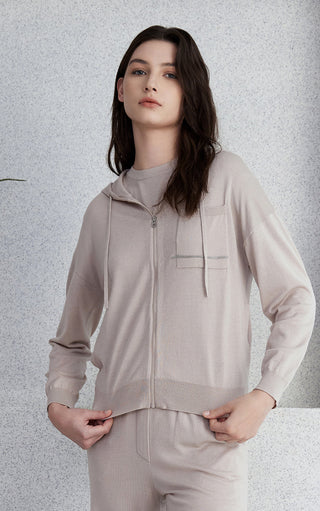 Light gray wool-silk hooded zip knit cardigan with drawstring hood and front zip.