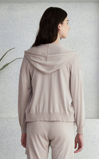 Light gray hooded zip knit cardigan back view with drawstring hood and ribbed cuffs.