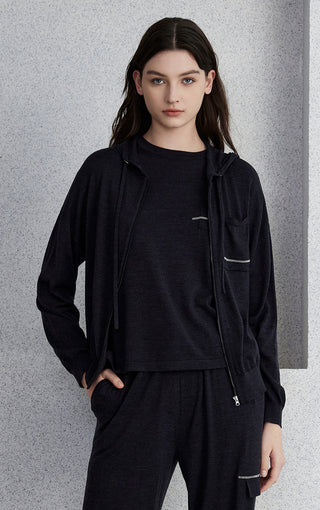 Black wool-silk hooded zip knit cardigan with front pockets and drawstring hood.