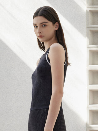 Graphite gray sleeveless sweater vest with ribbed knit texture and contrast trim