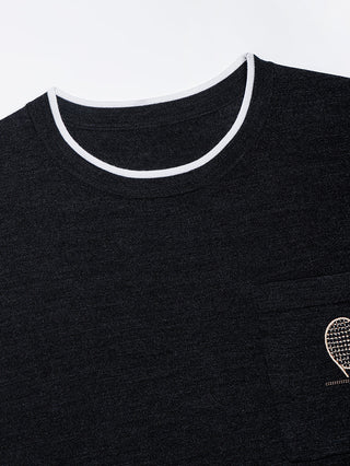 Close-up of dark gray crew neck with contrast white rib trim