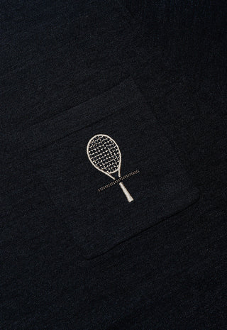 Close-up of dark gray knit t-shirt chest pocket with decorative tennis-racket applique