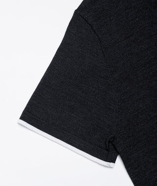 Close-up of dark gray t-shirt sleeve hem with contrast white rib cuff