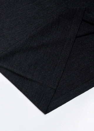 Close-up of dark gray wool-silk knit t-shirt fabric and side seam