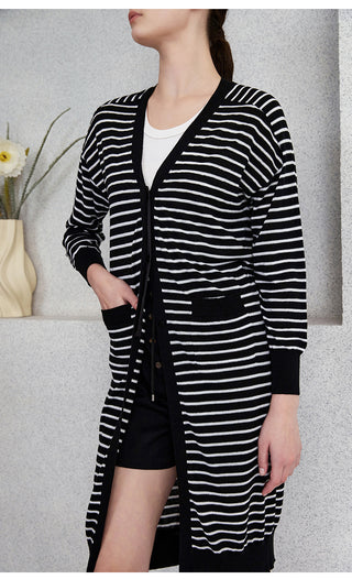 Black-and-white striped cardigan with open V-neck front and long sleeves.
