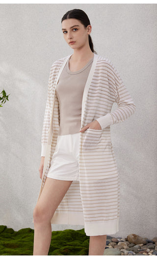 Front view of white long striped cardigan with buttons, tan and blue stripes