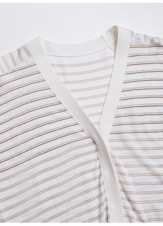 Close-up of white striped cardigan neckline and button placket, tan and blue stripes