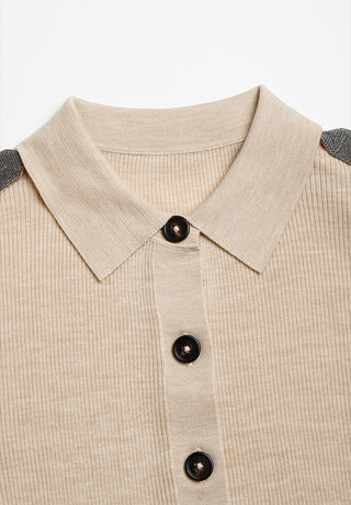Beige polo cardigan neckline with pointed collar and black button placket