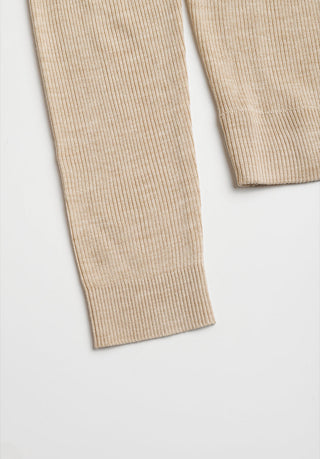 Beige ribbed knit sleeve with clean hem on polo cardigan