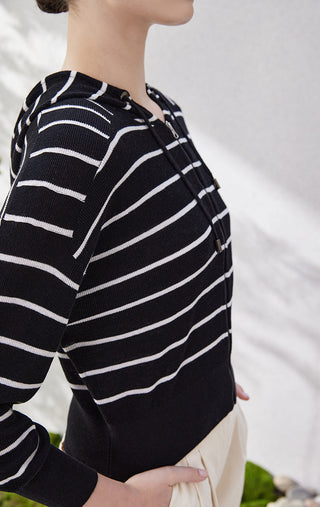 Black knit cardigan sleeve with white horizontal stripes and zip-front edge