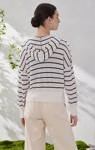 Back view of black-and-white striped zip-hooded knit cardigan with full hood