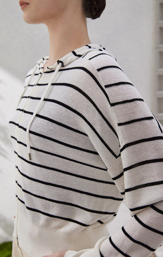 Black-and-white striped zip-hooded knit cardigan, hood drawstrings and front zipper detail
