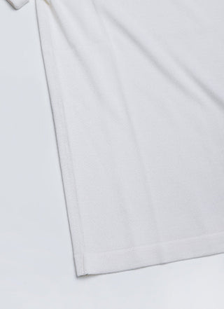 White sheer knit t-shirt hem with neat stitched edge and side seam detail