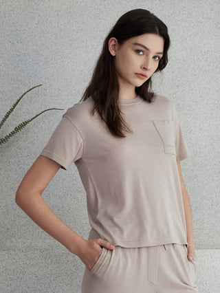 Beige wool-silk short-sleeve knit top with chest pocket and beaded accent stripe