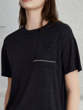Close-up of graphite gray knit top chest pocket with thin beaded stripe detail