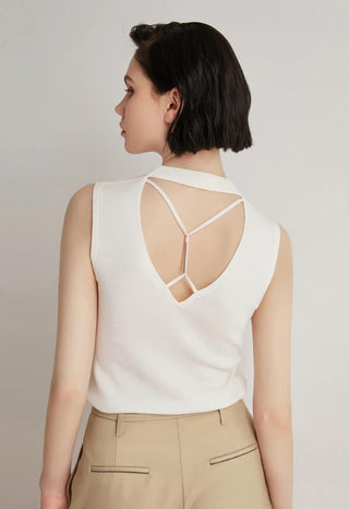 White tank top open-back detail with crisscross straps across the upper back