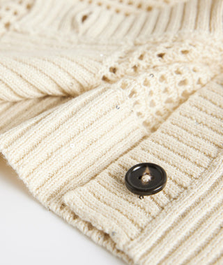 Light beige ribbed cuff and hem with button, sequined openwork knit detail