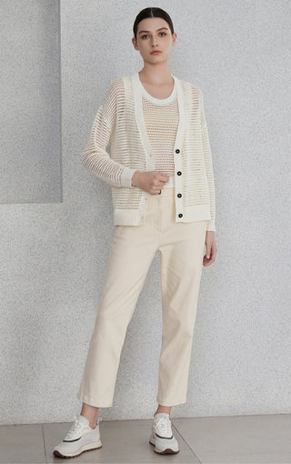 Cream linen openwork cardigan with button placket and ribbed hem, worn open