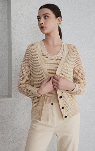 Camel linen openwork cardigan with button front, worn over a light top