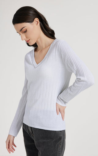 White V-neck ribbed knit top with long sleeves, neckline beaded trim detail