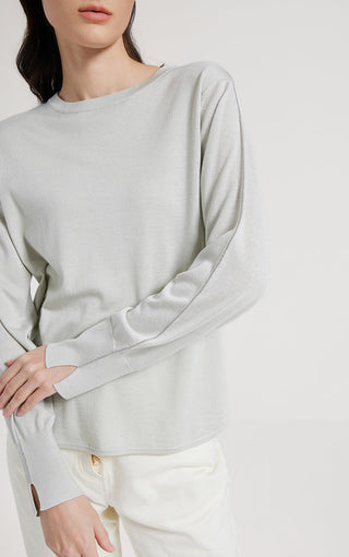 Sage green long-sleeve knit top with crew neck, relaxed fit