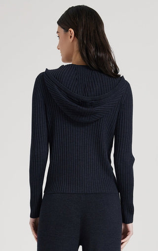 Black zip knit cardigan from back with hood drape and ribbed long sleeves.