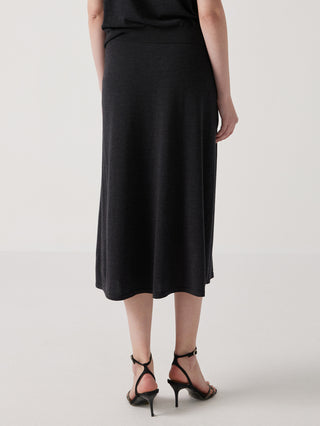 Black wool-silk midi skirt with smooth drape and no embroidery visible, side view