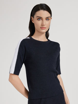 Graphite gray knit top with crew neck and white contrast sleeve stripe detail