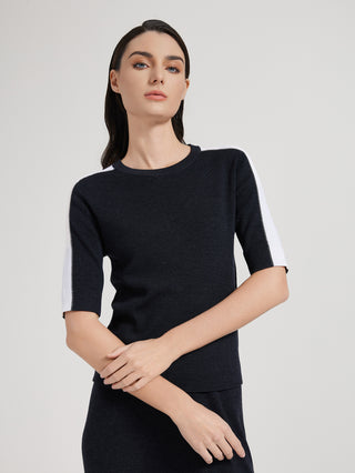 Graphite gray short-sleeve knit top with white contrast stripe along outer sleeves