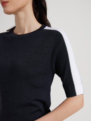 Graphite gray knit top close-up with ribbed crew neck and white side sleeve stripe