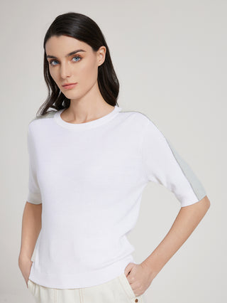 White crewneck knit top, short sleeves with subtle contrast detailing on arms