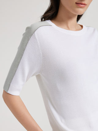 White knit top with contrast gray sleeve panel and crew neckline