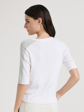 Back view of white knit top with light gray contrast stripe on sleeves