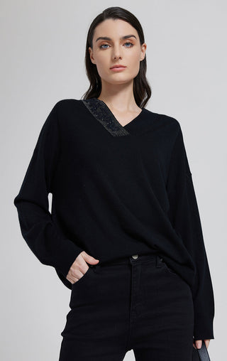 Black wool-silk knit top with beaded V-neck, long sleeves, relaxed fit