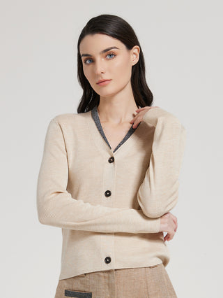 Beige wool-silk cardigan sweater with dark collar trim and black buttons, long sleeves