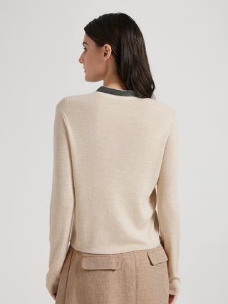Beige cardigan sweater back view, long sleeves and ribbed hem, V-neck with trim