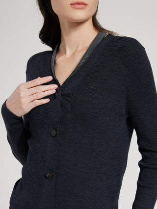 Graphite gray cardigan close-up: V-neck trim and dark button placket, long sleeves