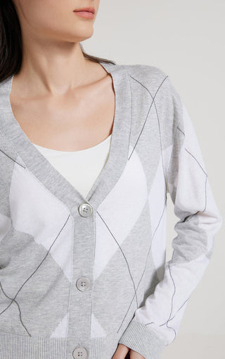 Close-up of gray argyle check cardigan neckline with round buttons and ribbed trim