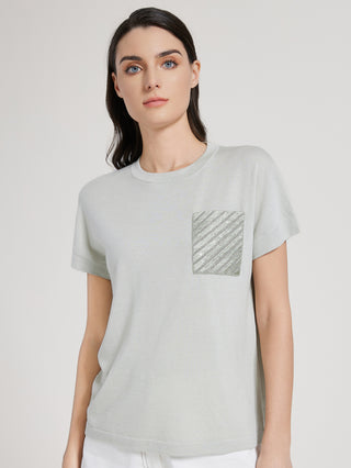 Front view of sage green knit T-shirt with square sequin-beaded chest pocket
